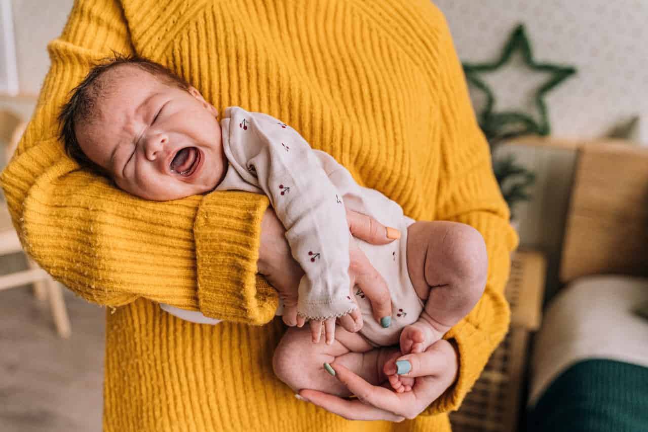 Baby Crying While Breastfeeding: 12 Reasons, Tips, & More